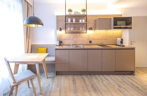 Hinterstoder Apartment | Modern studio with living and sleeping area.