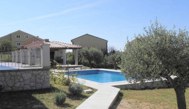 One bedroom apartment with a swimming pool Barbat, Rab (A-22358-b)
