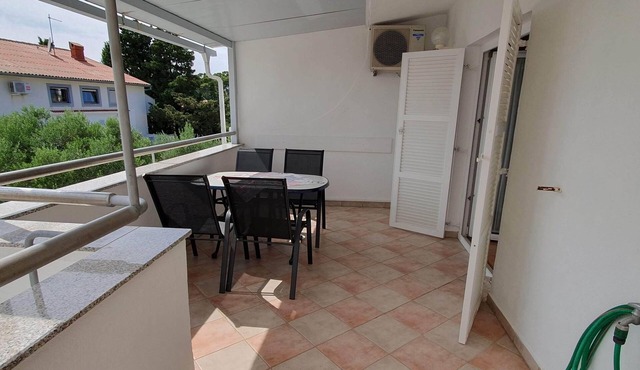 Two bedroom apartment with terrace and sea view Rab (A-14792-a)