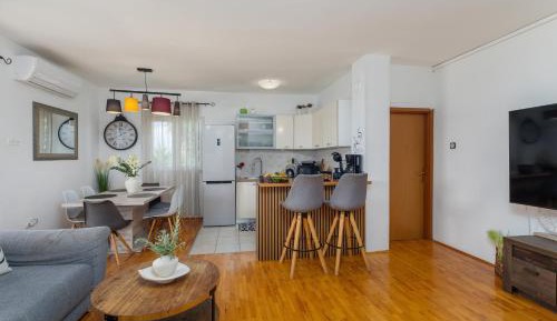 Three-Bedroom Apartment with Terrace and Sea View