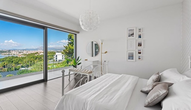 Large private estate 700 feet from the beach featuring a 36 sqm heated private pool, 5 cozy en suite bedrooms, seven bathrooms, and 3 separate kitchen areas